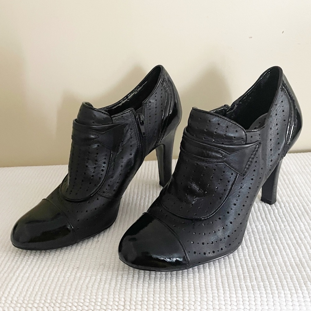BCBG Perforated Black High Heeled Ankle Bootie with Patent Leather Round Toe